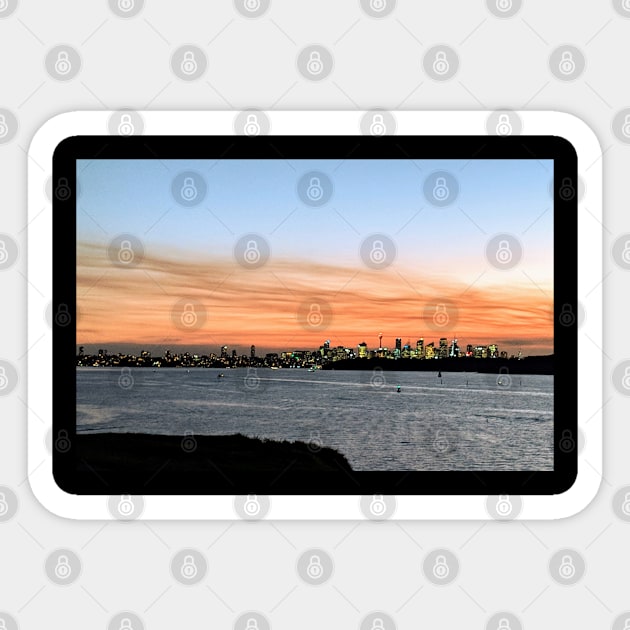 Orange sunset river with night lights cityscape Sticker by topsnthings